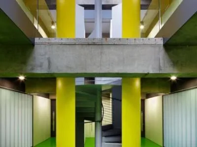 Colour-finished architectural steel columns in a public building interior