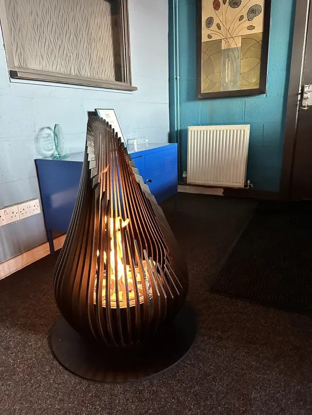 Bespoke fabricated metal pendant feature in a hospitality interior