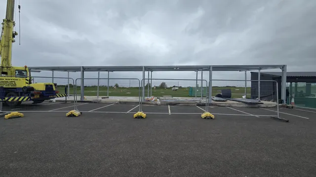 Completed steel canopy structure over a commercial car park