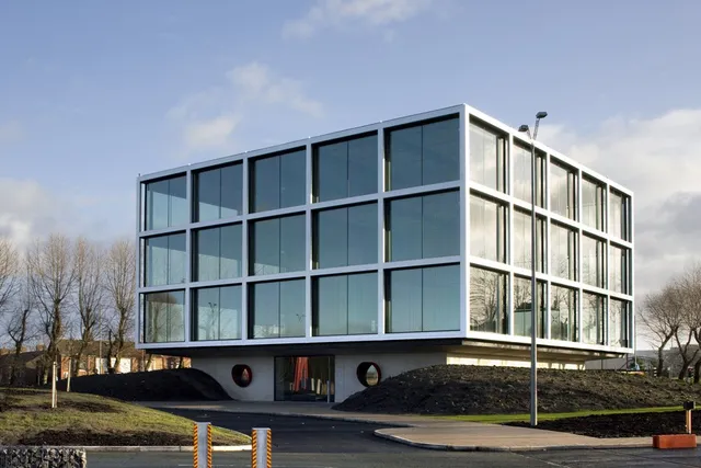 Structural steelwork supporting a fully glazed commercial office facade