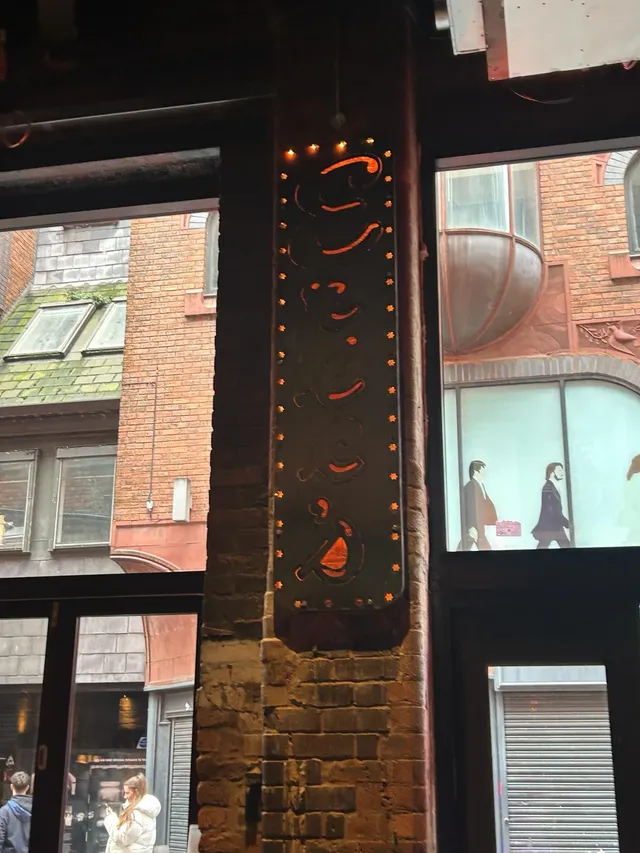 Weathering steel feature panel fixed to a brick facade in Liverpool