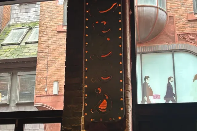 Weathering steel feature panel fixed to a brick facade in Liverpool