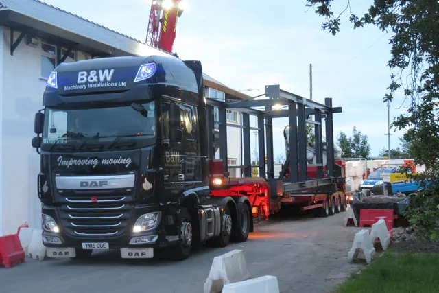 Prefabricated steel footbridge module leaving the works on a low-loader