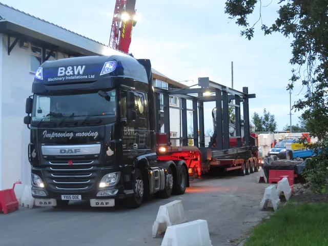 Prefabricated steel footbridge module leaving the works on a low-loader