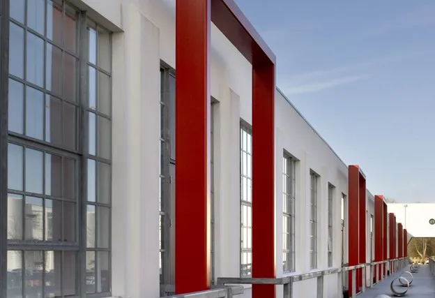 Completed industrial unit elevation with red and white steel cladding details