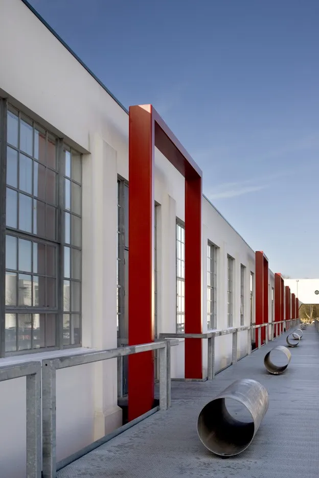 Completed industrial unit elevation with red and white steel cladding details