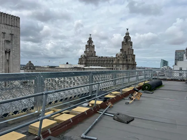 Architectural balustrade installation with the Royal Liver Building on the Liverpool skyline