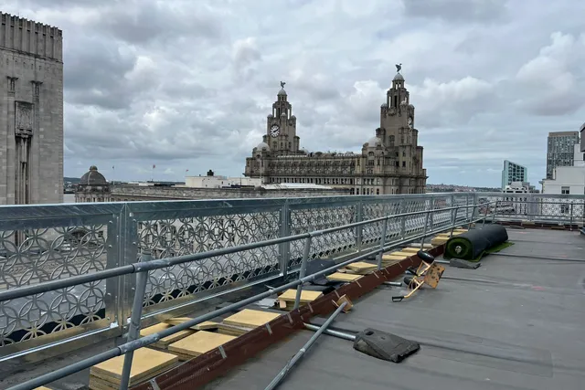 Architectural balustrade installation with the Royal Liver Building on the Liverpool skyline