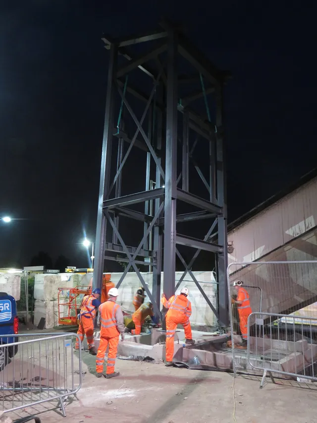 MSR erection crew installing a steel tower frame during a night shift