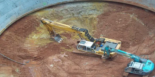 Excavator working within a circular shaft excavation supported by MSR steelwork