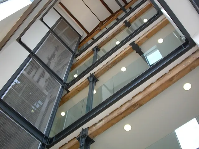 Steel and structural glass balustrades to an atrium stairwell, viewed from below