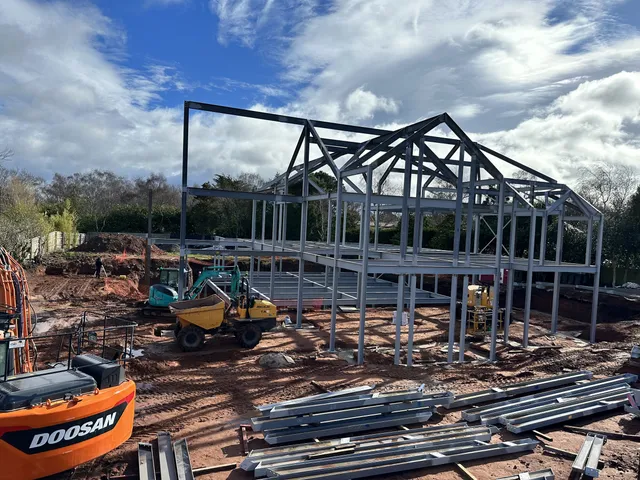 Steel portal frame erection in progress on a commercial development